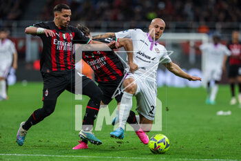 2023-05-03 - Ismael Bennacer of AC Milan competes for the ball with Vlad Chiriches of US Cremonese and Brahim Diaz of AC Milan during Serie A 2022/23 football match between AC Milan and US Cremonese at San Siro Stadium, Milan, Italy on May 03, 2023 - AC MILAN VS US CREMONESE - ITALIAN SERIE A - SOCCER