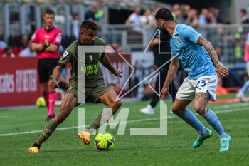 2023-05-06 - Junior Messias of AC Milan competes for the ball with Elseid Hysaj of SS Lazio during Serie A 2022/23 football match between AC Milan and SS Lazio at San Siro Stadium, Milan, Italy on May 06, 2023 - AC MILAN VS SS LAZIO - ITALIAN SERIE A - SOCCER
