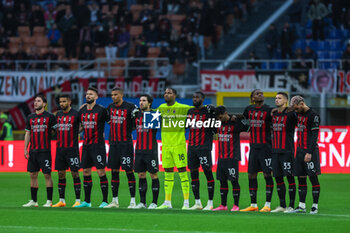 2023-05-20 - AC Milan players stand on the field observing one minute silence in memory of the victims of Emilia Romagna flood during Serie A 2022/23 football match between AC Milan and UC Sampdoria at San Siro Stadium, Milan, Italy on May 20, 2023 - AC MILAN VS UC SAMPDORIA - ITALIAN SERIE A - SOCCER