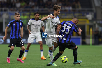 2023-05-27 - Giorgio Scalvini of Atalanta BC competes for the ball with Danilo D'Ambrosio of FC Internazionale during Serie A 2022/23 football match between FC Internazionale and Atalanta BC at Giuseppe Meazza Stadium, Milan, Italy on May 27, 2023 - INTER - FC INTERNAZIONALE VS ATALANTA BC - ITALIAN SERIE A - SOCCER