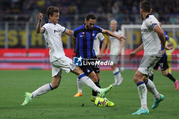 2023-05-27 - Giorgio Scalvini of Atalanta BC competes for the ball with Hakan Calhanoglu of FC Internazionale during Serie A 2022/23 football match between FC Internazionale and Atalanta BC at Giuseppe Meazza Stadium, Milan, Italy on May 27, 2023 - INTER - FC INTERNAZIONALE VS ATALANTA BC - ITALIAN SERIE A - SOCCER