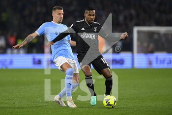2023-04-08 - Alex Sandro of Juventus F.C. and Sergej Milinković-Savić of S.S. LAZIO during the 29th day of the Serie A Championship between S.S. Lazio vs Juventus F.C. on April 8, 2023 at the Stadio Olimpico in Rome, Italy. - SS LAZIO VS JUVENTUS FC - ITALIAN SERIE A - SOCCER