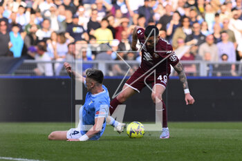 2023-04-22 - Nemanja Radonjic of Torino F.C. and Gil Patric of S.S. LAZIO during the 31th day of the Serie A Championship between S.S. Lazio vs Torino F.C. on April 22, 2023 at the Stadio Olimpico in Rome, Italy. - SS LAZIO VS TORINO FC - ITALIAN SERIE A - SOCCER