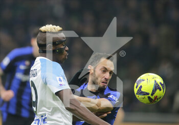 2023-01-04 - Victor Osimhen of SSC Napoli and Hakan Calhanoglu of Fc Inter during the Italian Serie A, football match between Fc Inter and Ssc Napoli on Jannuary 04, 2023 at San Siro Stadium, Milan, Italy. Photo Nderim Kaceli - INTER - FC INTERNAZIONALE VS SSC NAPOLI - ITALIAN SERIE A - SOCCER