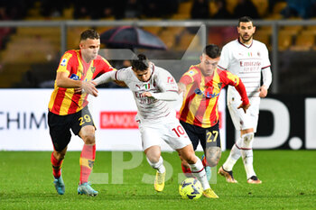 2023-01-14 - Brahim Diaz, midfielder of Milan, between Alexis Blin, midfielder of Lecce and Gabriel Strefezza, forward of Lecce during the Italian championship Serie A football match between US Lecce and AC Milan on January 14, 2023 at Via del Mare stadium in Lecce, Italy - FOOTBALL - ITALIAN CHAMP - LECCE V AC MILAN - ITALIAN SERIE A - SOCCER