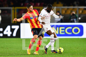 2023-01-14 - Pierre Kalulu, defender of Milan and Lorenzo Colombo, forward of Lecce during the Italian championship Serie A football match between US Lecce and AC Milan on January 14, 2023 at Via del Mare stadium in Lecce, Italy - FOOTBALL - ITALIAN CHAMP - LECCE V AC MILAN - ITALIAN SERIE A - SOCCER