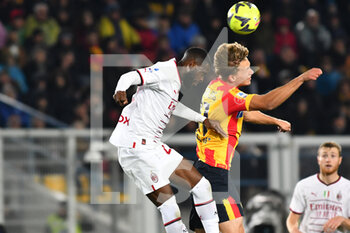 2023-01-14 - Joel Voelkerling Persson, forward of Lecce and Pierre Kalulu, defender of Milan, during the Italian championship Serie A football match between US Lecce and AC Milan on January 14, 2023 at Via del Mare stadium in Lecce, Italy - FOOTBALL - ITALIAN CHAMP - LECCE V AC MILAN - ITALIAN SERIE A - SOCCER