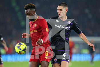 2023-01-15 - Tammy Abraham of Roma (L) vies for the ball with Nikola Milenkovic of Fiorentina (R) during the Italian championship Serie A football match between AS Roma and ACF Fiorentina on January 15, 2023 at Stadio Olimpico in Rome, Italy - FOOTBALL - ITALIAN CHAMP - AS ROMA V FIORENTINA - ITALIAN SERIE A - SOCCER