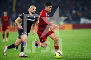 2023-01-15 - Sofyan Amrabat of Fiorentina (L) vies for the ball with Paulo Dybala of Roma (R) during the Italian championship Serie A football match between AS Roma and ACF Fiorentina on January 15, 2023 at Stadio Olimpico in Rome, Italy - FOOTBALL - ITALIAN CHAMP - AS ROMA V FIORENTINA - ITALIAN SERIE A - SOCCER