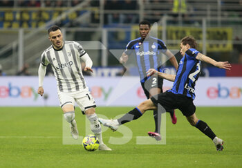 2023-03-19 - Filip Kostic of Juventus and Nicolo Barella of FC Internazionale during the Italian Serie A football match between Fc Internazionale and Juventus Fc, on 19 March 2023 at Stadio Giuseppe Meazza, San Siro, Milan, Italy. Photo Nderim Kaceli - INTER - FC INTERNAZIONALE VS JUVENTUS FC - ITALIAN SERIE A - SOCCER