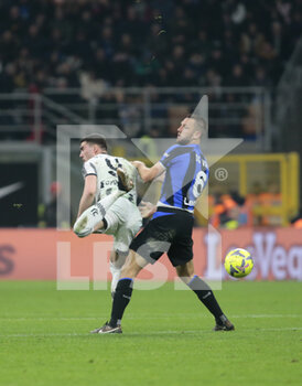 2023-03-19 - Dusan Vlahovic of Juventus and Stefan de Vrij of FC Internazionale during the Italian Serie A football match between Fc Internazionale and Juventus Fc, on 19 March 2023 at Stadio Giuseppe Meazza, San Siro, Milan, Italy. Photo Nderim Kaceli - INTER - FC INTERNAZIONALE VS JUVENTUS FC - ITALIAN SERIE A - SOCCER