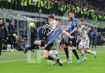 2023-03-19 - Stefan de Vrij of FC Internazionale and Dusan Vlahovic of Juventus during the Italian Serie A football match between Fc Internazionale and Juventus Fc, on 19 March 2023 at Stadio Giuseppe Meazza, San Siro, Milan, Italy. Photo Nderim Kaceli - INTER - FC INTERNAZIONALE VS JUVENTUS FC - ITALIAN SERIE A - SOCCER