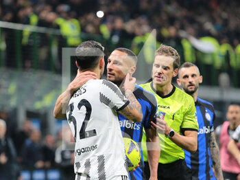 2023-03-19 - Leandro Paredes of Juventus and Danilo D'Ambrosio of FC Internazionale during the Italian Serie A football match between Fc Internazionale and Juventus Fc, on 19 March 2023 at Stadio Giuseppe Meazza, San Siro, Milan, Italy. Photo Nderim Kaceli - INTER - FC INTERNAZIONALE VS JUVENTUS FC - ITALIAN SERIE A - SOCCER
