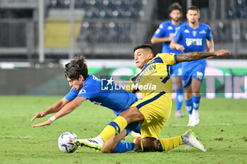 2023-08-19 - Empoli FC's Italian forward Stiven Shpendi against Hellas Verona FC's Argentinian defender Bruno Amione - EMPOLI FC VS HELLAS VERONA FC - ITALIAN SERIE A - SOCCER