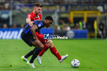 2023-08-19 - Denzel Dumfries of FC Internazionale competes for the ball with Georgios Kyriakopoulos of AC Monza during Serie A 2023/24 football match between FC Internazionale and AC Monza at Giuseppe Meazza Stadium, Milan, Italy on August 19, 2023 - INTER - FC INTERNAZIONALE VS AC MONZA - ITALIAN SERIE A - SOCCER