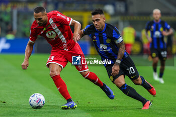 2023-08-19 - Danilo D'Ambrosio of AC Monza competes for the ball with Lautaro Martinez of FC Internazionale during Serie A 2023/24 football match between FC Internazionale and AC Monza at Giuseppe Meazza Stadium, Milan, Italy on August 19, 2023 - INTER - FC INTERNAZIONALE VS AC MONZA - ITALIAN SERIE A - SOCCER