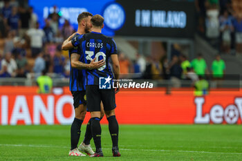 2023-08-19 - Carlos Augusto of FC Internazionale hugs Marko Arnautovic of FC Internazionale at the end of the match during Serie A 2023/24 football match between FC Internazionale and AC Monza at Giuseppe Meazza Stadium, Milan, Italy on August 19, 2023 - INTER - FC INTERNAZIONALE VS AC MONZA - ITALIAN SERIE A - SOCCER