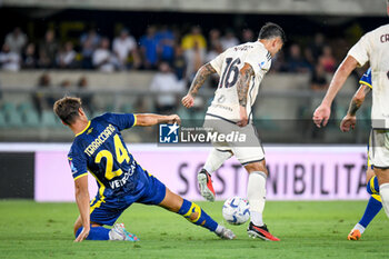 2023-08-26 - Roma's Leandro Paredes hindered by Verona's Filippo Terracciano - HELLAS VERONA FC VS AS ROMA - ITALIAN SERIE A - SOCCER