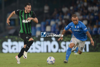 2023-08-27 - Matias Vina of U.S. Sassuolo competes for the ball with Stanislav Lobotka of SSC Napoli during Serie A between SSC Napoli vs US Sassuolo at Diego Armando Maradona Stadium - SSC NAPOLI VS US SASSUOLO - ITALIAN SERIE A - SOCCER