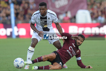 2023-08-28 - Christian Kabasele of Udinese Calcio competes for the ball with Antonio Candreva of US Salernitana 1919 during Serie A between US Salernitana 1919 vs Udinese Calcio at Arechi Stadium - US SALERNITANA VS UDINESE CALCIO - ITALIAN SERIE A - SOCCER