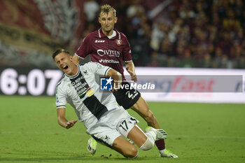 2023-08-28 - Lorenzo Lucca of Udinese Calcio competes for the ball with Norbert Gyomberof US Salernitana 1919 during Serie A between US Salernitana 1919 vs Udinese Calcio at Arechi Stadium - US SALERNITANA VS UDINESE CALCIO - ITALIAN SERIE A - SOCCER