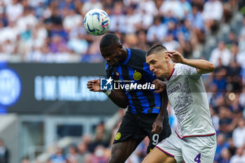 2023-09-03 - Marcus Thuram of FC Internazionale competes for the ball with Nikola Milenkovic of ACF Fiorentina during Serie A 2023/24 football match between FC Internazionale and ACF Fiorentina at Giuseppe Meazza Stadium, Milan, Italy on September 03, 2023 - INTER - FC INTERNAZIONALE VS ACF FIORENTINA - ITALIAN SERIE A - SOCCER