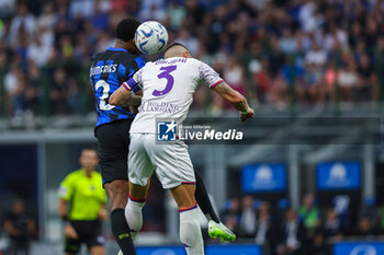 2023-09-03 - Denzel Dumfries of FC Internazionale competes for the ball with Cristiano Biraghi of ACF Fiorentina during Serie A 2023/24 football match between FC Internazionale and ACF Fiorentina at Giuseppe Meazza Stadium, Milan, Italy on September 03, 2023 - INTER - FC INTERNAZIONALE VS ACF FIORENTINA - ITALIAN SERIE A - SOCCER