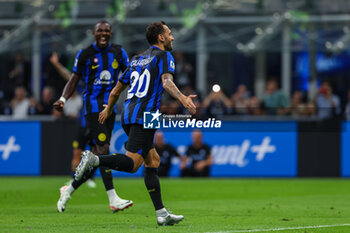 2023-09-03 - Hakan Calhanoglu of FC Internazionale celebrates after scoring a goal during Serie A 2023/24 football match between FC Internazionale and ACF Fiorentina at Giuseppe Meazza Stadium, Milan, Italy on September 03, 2023 - INTER - FC INTERNAZIONALE VS ACF FIORENTINA - ITALIAN SERIE A - SOCCER