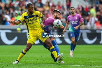2023-09-23 - Olivier Giroud of AC Milan competes for the ball with Isak Hein of Hellas Verona FC during Serie A 2023/24 football match between AC Milan and Hellas Verona FC at San Siro Stadium, Milan, Italy on September 23, 2023 - AC MILAN VS HELLAS VERONA FC - ITALIAN SERIE A - SOCCER