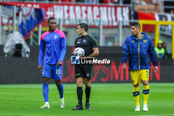 2023-09-23 - Referee Fabio Maresca performs a pitch inspection with the two captains Davide Faraoni of Hellas Verona FC and Rafael Leao of AC Milan prior to delaying the kick off for 25 minutes due to heavy rainfall during Serie A 2023/24 football match between AC Milan and Hellas Verona FC at San Siro Stadium, Milan, Italy on September 23, 2023 - AC MILAN VS HELLAS VERONA FC - ITALIAN SERIE A - SOCCER