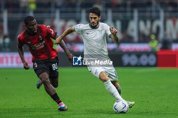 2023-09-30 - Luis Alberto of SS Lazio competes for the ball with Yunus Musah of AC Milan during Serie A 2023/24 football match between AC Milan and SS Lazio at San Siro Stadium, Milan, Italy on September 30, 2023 - AC MILAN VS SS LAZIO - ITALIAN SERIE A - SOCCER