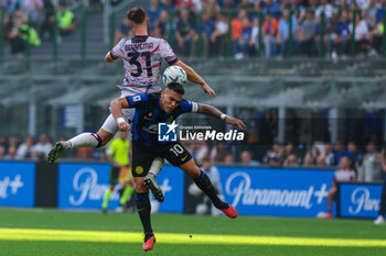2023-10-07 - Lautaro Martinez of FC Internazionale competes for the ball with Sam Beukema of Bologna FC during Serie A 2023/24 football match between FC Internazionale and Bologna FC at Giuseppe Meazza Stadium, Milan, Italy on October 07, 2023 - INTER - FC INTERNAZIONALE VS BOLOGNA FC - ITALIAN SERIE A - SOCCER