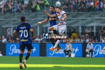 2023-10-07 - Lautaro Martinez of FC Internazionale competes for the ball with Oussama El Azzouzi of Bologna FC during Serie A 2023/24 football match between FC Internazionale and Bologna FC at Giuseppe Meazza Stadium, Milan, Italy on October 07, 2023 - INTER - FC INTERNAZIONALE VS BOLOGNA FC - ITALIAN SERIE A - SOCCER