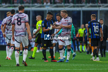 2023-10-07 - Lautaro Martinez of FC Internazionale and Lewis Ferguson of Bologna FC seen at the end of the match during Serie A 2023/24 football match between FC Internazionale and Bologna FC at Giuseppe Meazza Stadium, Milan, Italy on October 07, 2023 - INTER - FC INTERNAZIONALE VS BOLOGNA FC - ITALIAN SERIE A - SOCCER