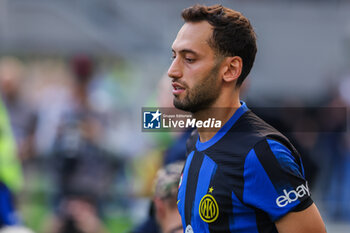 2023-10-07 - Hakan Calhanoglu of FC Internazionale looks on during Serie A 2023/24 football match between FC Internazionale and Bologna FC at Giuseppe Meazza Stadium, Milan, Italy on October 07, 2023 - INTER - FC INTERNAZIONALE VS BOLOGNA FC - ITALIAN SERIE A - SOCCER