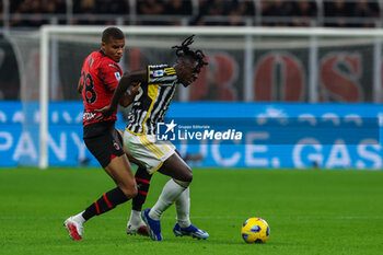 2023-10-22 - Moise Kean of Juventus FC competes for the ball with Malick Thiaw of AC Milan during Serie A 2023/24 football match between AC Milan and Juventus FC at San Siro Stadium, Milan, Italy on October 22, 2023 - AC MILAN VS JUVENTUS FC - ITALIAN SERIE A - SOCCER