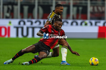 2023-10-22 - Rafael Leao of AC Milan (L) competes for the ball with Gleison Bremer of Juventus FC (R) during Serie A 2023/24 football match between AC Milan and Juventus FC at San Siro Stadium, Milan, Italy on October 22, 2023 - AC MILAN VS JUVENTUS FC - ITALIAN SERIE A - SOCCER