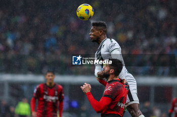 2023-11-04 - Olivier Giroud of AC Milan competes for the ball with Christian Kabasele of Udinese Calcio during Serie A 2023/24 football match between AC Milan and Udinese Calcio at San Siro Stadium, Milan, Italy on November 04, 2023 - AC MILAN VS UDINESE CALCIO - ITALIAN SERIE A - SOCCER