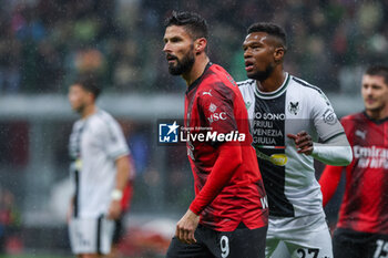 2023-11-04 - Olivier Giroud of AC Milan and Christian Kabasele of Udinese Calcio seen in action during Serie A 2023/24 football match between AC Milan and Udinese Calcio at San Siro Stadium, Milan, Italy on November 04, 2023 - AC MILAN VS UDINESE CALCIO - ITALIAN SERIE A - SOCCER
