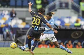 2023-11-12 - SSC Napoli's Cameroonian midfielder Andre Zambo Anguissa challenges for the ball with Empoli's Italian forward Matteo Cancellieri during the Serie A football match between SSC Napoli and Empoli at the Diego Armando Maradona Stadium in Naples, southern Italy, on November 12, 2023. - SSC NAPOLI VS EMPOLI FC - ITALIAN SERIE A - SOCCER