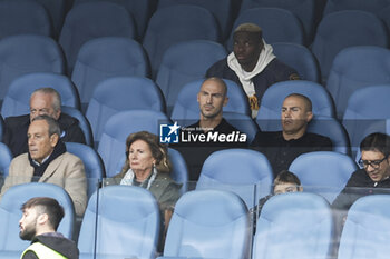 2023-11-12 - In the official stands, SSC Napoli's Nigerian forward Victor Osimhen and brothers Paolo and Fabio Cannavaro watch the match together with Napoli president Aurelio De laurentiis during the Serie A football match between SSC Napoli and Empoli at the Diego Armando Maradona Stadium in Naples, southern Italy, on November 12, 2023. - SSC NAPOLI VS EMPOLI FC - ITALIAN SERIE A - SOCCER