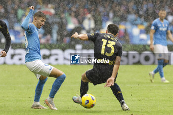 2023-11-12 - SSC Napoli’s Danish midfielder Jesper Lindstrom challenges for the ball with Empoli's New Zealand defender Liberato Cacace during the Serie A football match between SSC Napoli and Empoli at the Diego Armando Maradona Stadium in Naples, southern Italy, on November 12, 2023. - SSC NAPOLI VS EMPOLI FC - ITALIAN SERIE A - SOCCER