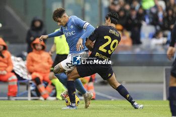 2023-11-12 - SSC Napoli's Italian defender Giovanni Di Lorenzo challenges for the ball with Empoli's Italian midfielder Youssef Maleh during the Serie A football match between SSC Napoli and Empoli at the Diego Armando Maradona Stadium in Naples, southern Italy, on November 12, 2023. - SSC NAPOLI VS EMPOLI FC - ITALIAN SERIE A - SOCCER