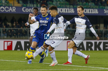 2023-11-27 - Valentin Gendrey of US Lecce  battle for the ball with Milan Djuric of Hellas Verona FC during Hellas Verona FC  vs US Lecce, 13° Serie A Tim 2023-24 game at Marcantonio Bentegodi Stadium in Verona (VR), Italy, on November 27, 2023. - HELLAS VERONA FC VS US LECCE - ITALIAN SERIE A - SOCCER