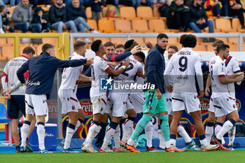 2023-12-03 - Charalampos Lykogiannis of Bologna FC celebrates after scoring a goal with teammates - US LECCE VS BOLOGNA FC - ITALIAN SERIE A - SOCCER