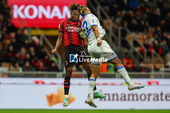 2023-12-02 - Samuel Chukwueze of AC Milan competes for the ball with Anthony Oyono of Frosinone Calcio during Serie A 2023/24 football match between AC Milan and Frosinone Calcio at San Siro Stadium, Milan, Italy on December 02, 2023 - AC MILAN VS FROSINONE CALCIO - ITALIAN SERIE A - SOCCER