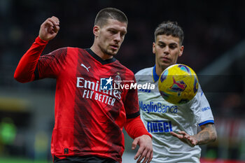2023-12-02 - Luka Jovic of AC Milan competes for the ball with Enzo Barrenechea of Frosinone Calcio during Serie A 2023/24 football match between AC Milan and Frosinone Calcio at San Siro Stadium, Milan, Italy on December 02, 2023 - AC MILAN VS FROSINONE CALCIO - ITALIAN SERIE A - SOCCER
