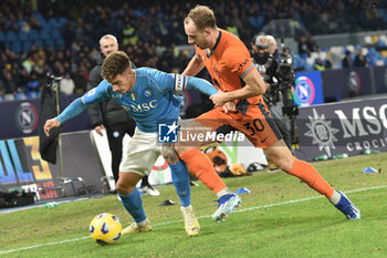 2023-12-03 - Giovanni Di Lorenzo of SSC Napoli competes for the ball with Carlos Augusto of FC Internazionale during Serie A between SSC Napoli vs FC Internazionale at Diego Armando Maradona Stadium - SSC NAPOLI VS INTER - FC INTERNAZIONALE - ITALIAN SERIE A - SOCCER