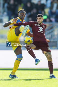 2023-12-10 - Frosinone's Nigerian defender Caleb Okoli challenges for the ball with Torino's Paraguayan forward Antonio Sanabria during the Serie A football match between Frosinone Calcio vs Torino at the Benito Stirpe stadium in Frosinone, Italy on December 10, 2023. - FROSINONE CALCIO VS TORINO FC - ITALIAN SERIE A - SOCCER