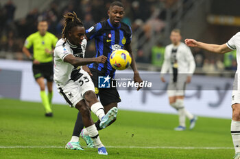 2023-12-09 - Marcus Thuram of FC Internazionale dcompetes for the ball with Jordan Zemura of Udinese Calcio uring Serie A 2023/24 football match between FC Internazionale and Udinese Calcio at Giuseppe Meazza Stadium, Milan, Italy on December 09, 2023 - INTER - FC INTERNAZIONALE VS UDINESE CALCIO - ITALIAN SERIE A - SOCCER